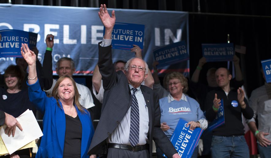 Democratic presidential candidate Sen. Bernie Sanders, I-Vt., and his wife Jane Sanders wave to the crowd during a campaign rally at the Burlington Memorial Center, on Thursday, Jan. 28, 2016, in Burlington, Iowa. (AP Photo/Evan Vucci)