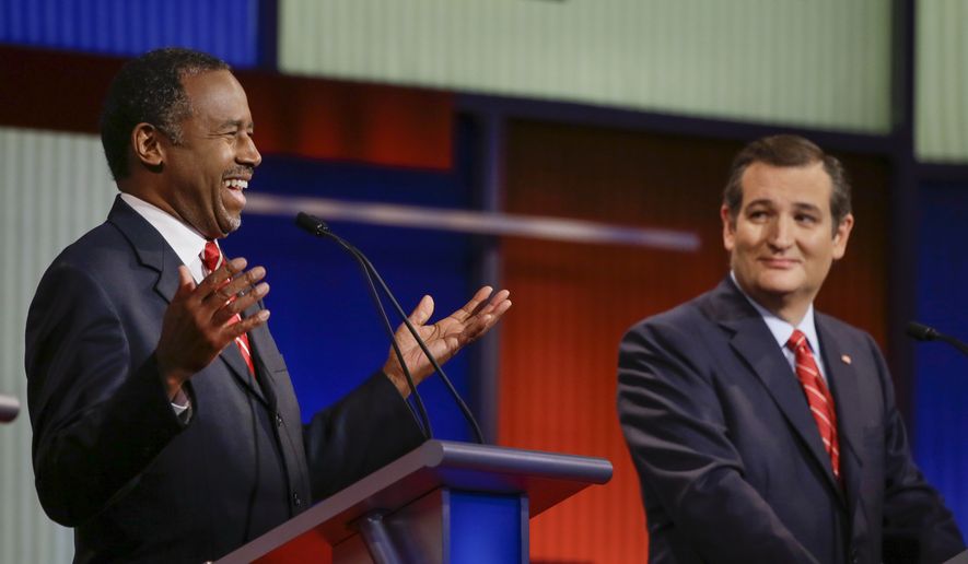 Republican presidential candidate retired neurosurgeon Ben Carson answers a question as Sen. Ted Cruz, R-Texas, looks on during a Republican presidential primary debate, Thursday, Jan. 28, 2016, in Des Moines, Iowa. (AP Photo/Charlie Neibergall) ** FILE **