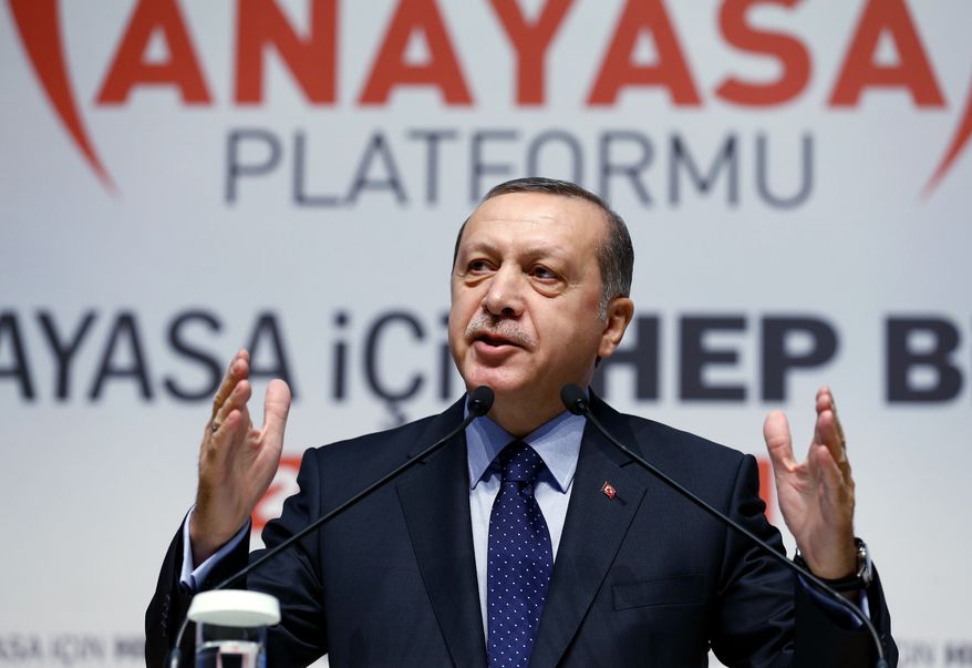 Turkey's President Recep Tayyip Erdogan addresses his supporters in Ankara, Turkey, Thursday, Jan. 28, 2016. Renewing a call for constitutional changes that would turn Turkey's political system into a presidential one, Erdogan said he does not want the changes for himself but for Turkey's political stability. His comments Thursday were in response to critics who fear that Erdogan -who has already displayed increasingly authoritarian tendencies- is eyeing a one-man rule. (Yasin Bulbul, Presidential Press Service, Pool via AP)
