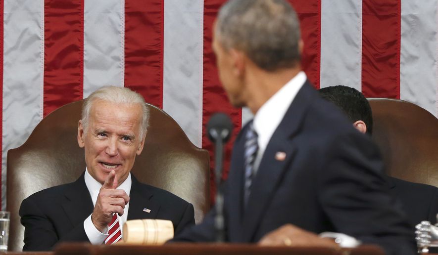FILE - In this Jan. 12, 2016 file-pool photo, Vice President Joe Biden points at President Barack Obama during the president&#x27;s State of the Union address to a joint session of Congress on Capitol Hill in Washington. President Barack Obama is creating a new federal task force to accelerate cancer research. He&#x27;s tapping Biden to chair the effort. Obama signed a presidential memorandum Thursday, Jan. 28, 2016, establishing the White House Cancer Moonshot Task Force. (AP Photo/Evan Vucci, Pool, File)