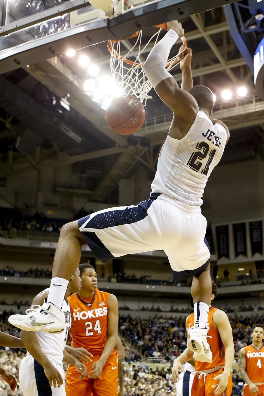 Pittsburgh's Sheldon Jeter (21) dunks after getting around Virginia Tech's Kerry Blackshear Jr. (24) during the first half of an NCAA college basketball game, Sunday, Jan. 31, 2016, in Pittsburgh. (AP Photo/Keith Srakocic)