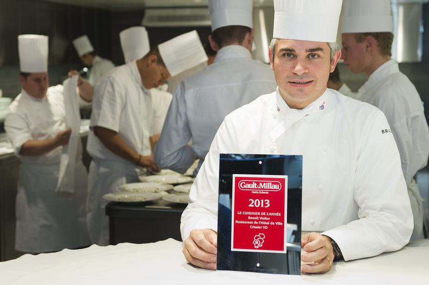 Chef Benoit Violier poses with the certificate as Chef of the year in his kitchen in the Hotel de Ville in Crissier, Switzerland, in this Oct. 8, 2012, file photo. Swiss police said Monday, Feb. 1, 2016, 3-star chef Violier, whose restaurant near Lausanne recently topped a list of the world's best, has been found dead of an apparent self-inflicted gunshot. (Jean-Christophe Bott/Keystone via AP)