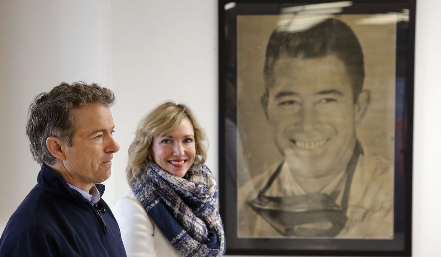 Republican presidential candidate, Sen. Rand Paul, R-Ky., with his wife, Kelley, waits to be introduced during a town hall at National Sprint Car Hall of Fame and Museum in Knoxville, Iowa, Friday, Jan. 29, 2016. (AP Photo/Patrick Semansky)