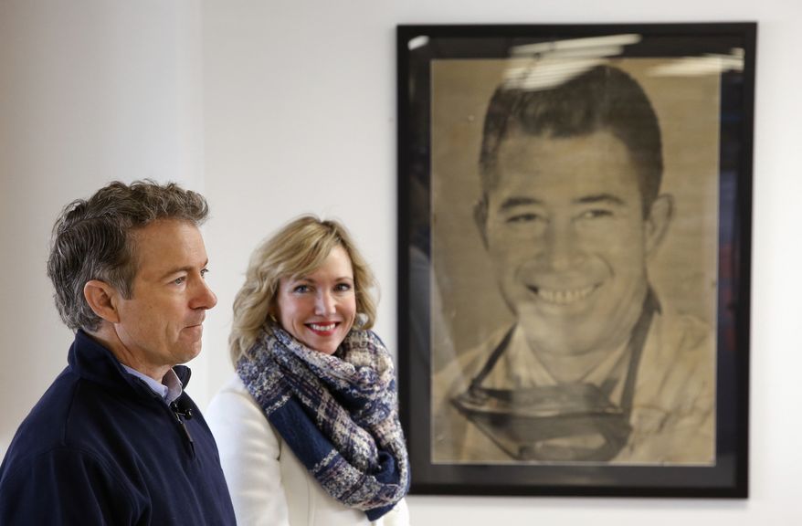 Republican presidential candidate, Sen. Rand Paul, R-Ky., with his wife, Kelley, waits to be introduced during a town hall at National Sprint Car Hall of Fame and Museum in Knoxville, Iowa, Friday, Jan. 29, 2016. (AP Photo/Patrick Semansky)