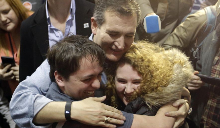 Republican presidential candidate, Sen. Ted Cruz, R-Texas, hugs Arden Jurskis and Kenzy Peach after Arden proposed Kenzy in front of Cruz at a campaign event at Iowa State Fairgrounds, Sunday, Jan. 31, 2016, in Des Moines, Iowa. Kenzy said yes. (AP Photo/Chris Carlson)