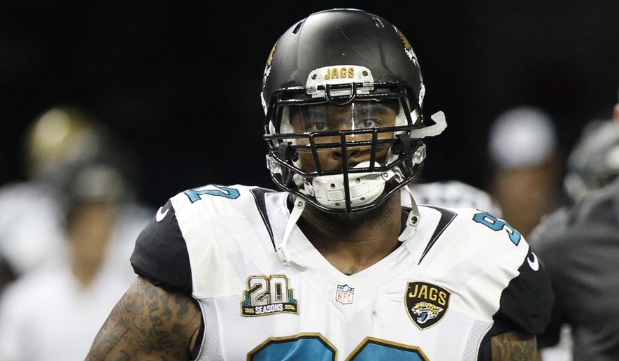 Jacksonville Jaguars defensive end Ziggy Hood (92) runs on to Ford Field for the start of a preseason NFL football game against the Detroit Lions in Detroit, Friday, Aug. 22, 2014.  (AP Photo/Duane Burleson)