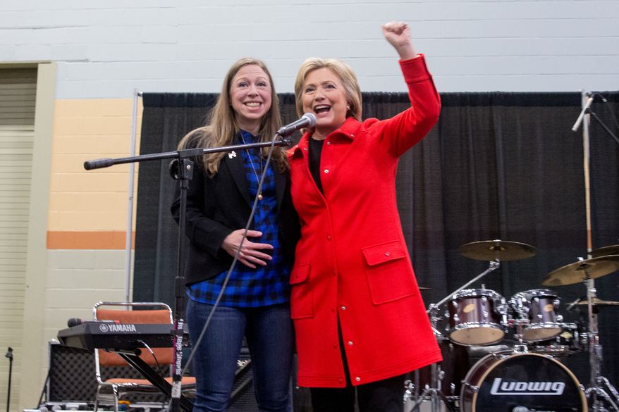 Democratic presidential candidate Hillary Clinton, accompanied by her daughter Chelsea Clinton, speaks at the African American Festival, I&#39;ll Make Me a World Celebration Day at the Iowa Events Center in Des Moines, Iowa, Saturday, Jan. 30, 2016. (AP Photo/Andrew Harnik)