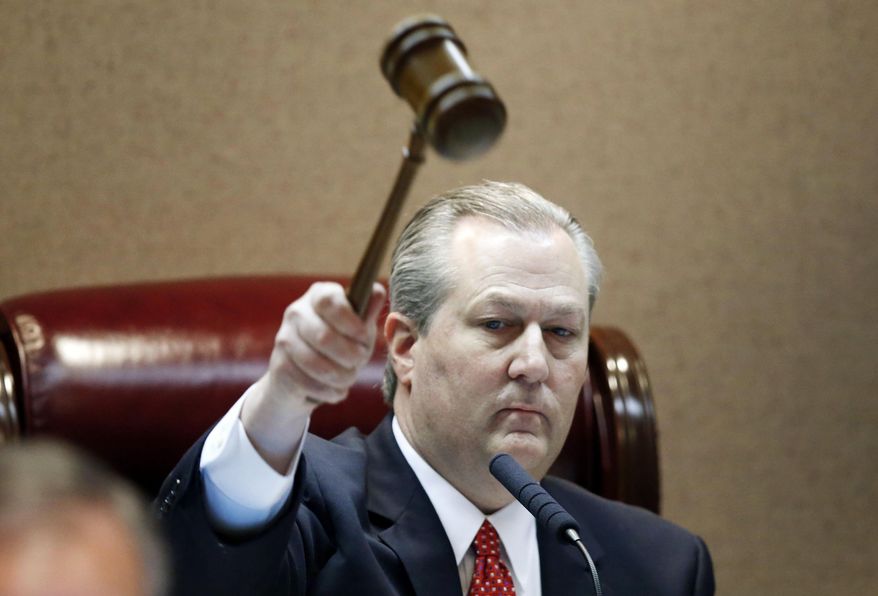 Rep. Mike Hubbard of Auburn, Ala., pounds the gavel to signify the beginning of Alabama legislation's opening, Tuesday, Feb. 2, 2016, in Montgomery, Ala. (AP Photo/Brynn Anderson)