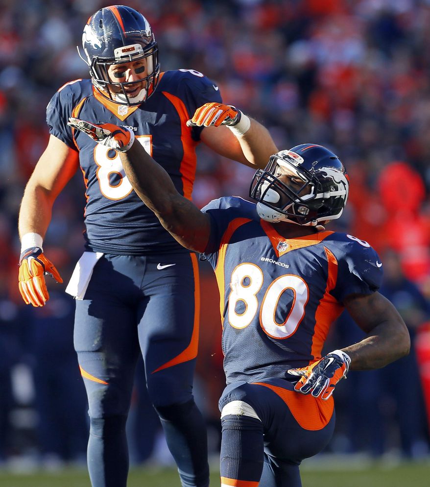 FILE - In this Dec. 13, 2015, file photo, Denver Broncos tight end Vernon Davis (80) signals first down as teammate Owen Daniels (81) looks on during the first half of an NFL football game against the Oakland Raiders in Denver. He may well play a bit part at this Super Bowl. But Davis is back in the Bay Area he has called home for more than a decade. He's also ready to win a ring after coming up short three years ago with the San Francisco 49ers. (AP Photo/Joe Mahoney, File)