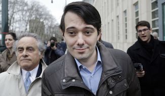 Former Turing Pharmaceuticals CEO Martin Shkreli, center, leaves court with his lawyer Benjamin Brafman, left, Wednesday, Feb. 3, 2016, in New York. Shkreli, who has become the poster child of pharmaceutical-industry greed after hiking the price of an anti-infection drug by more than 5,000 percent, is scheduled to appear at a congressional hearing on Thursday. (AP Photo/Seth Wenig)