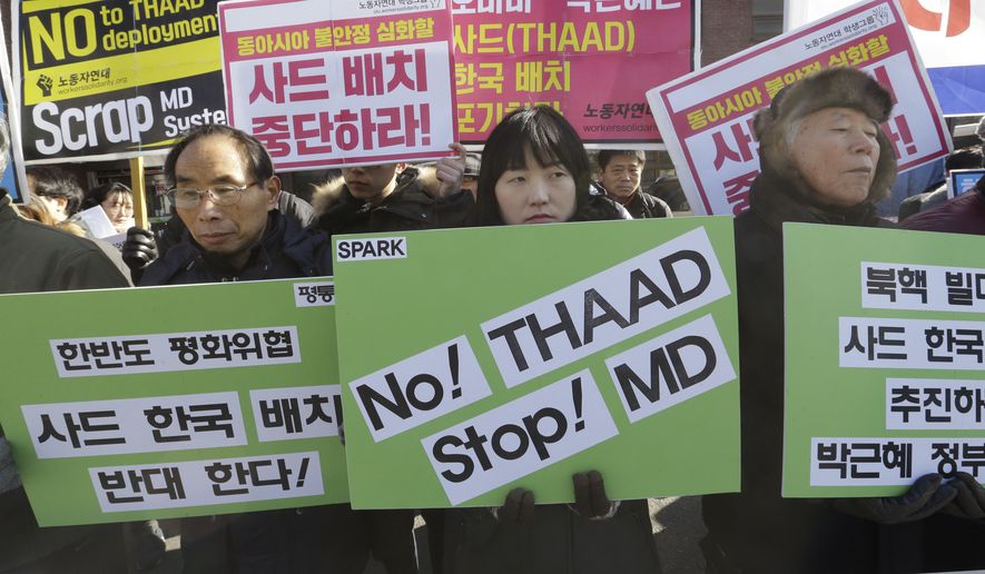 South Korean protesters stage a rally to oppose the possible deployment of the United States&#39; advanced defense system THAAD, a Terminal High-Altitude Area Defense, on Korea Peninsula, near the presidential house in Seoul, South Korea, Monday, Feb. 1, 2016. North Korea may be preparing to launch a rocket or missile, according to a U.S. defense official and expert analysis of commercial satellite imagery. The signs read &quot; Oppose the deployment of THAAD.&quot; (AP Photo/Ahn Young-joon)