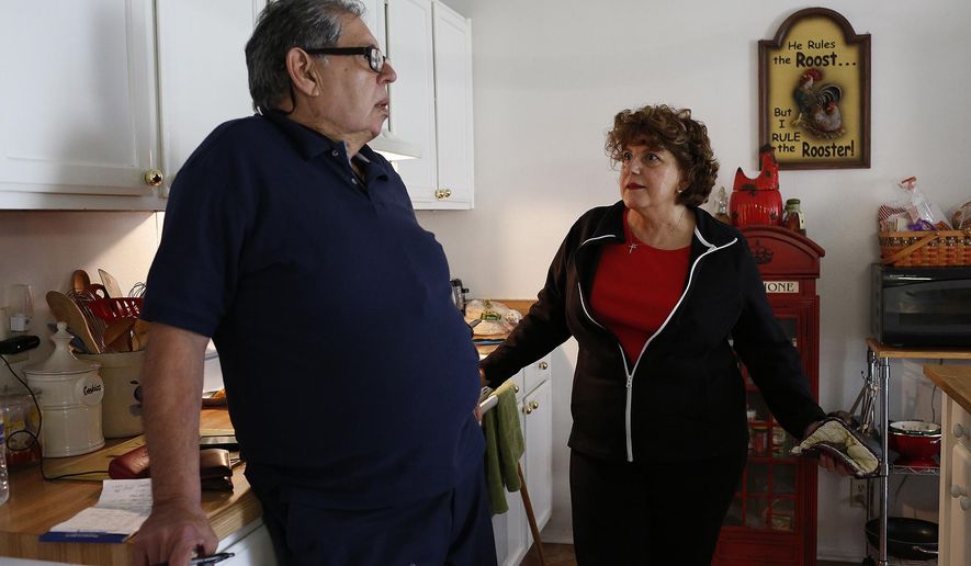 Yolanda Gill-Walker talks with Robert Gill about a bank procedure he was unsure how to handle as he visits in San Antonio on Friday, Jan. 29, 2016. Gill is a nonviolent drug offender who spent 25 years in prison until last summer, when President Obama commuted his life sentence. (Lisa Krantz/The San Antonio Express-News via AP) RUMBO DE SAN ANTONIO OUT; NO SALES; MANDATORY CREDIT