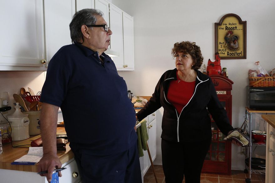 Yolanda Gill-Walker talks with Robert Gill about a bank procedure he was unsure how to handle as he visits in San Antonio on Friday, Jan. 29, 2016. Gill is a nonviolent drug offender who spent 25 years in prison until last summer, when President Obama commuted his life sentence. (Lisa Krantz/The San Antonio Express-News via AP) RUMBO DE SAN ANTONIO OUT; NO SALES; MANDATORY CREDIT