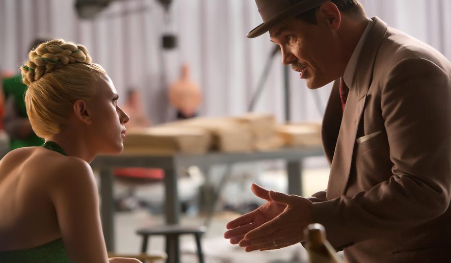 In this image released by Universal Pictures, Scarlett Johansson, left, and Josh Brolin appear in a scene from "Hail, Caesar!." (Alison Rosa/Universal Pictures via AP)