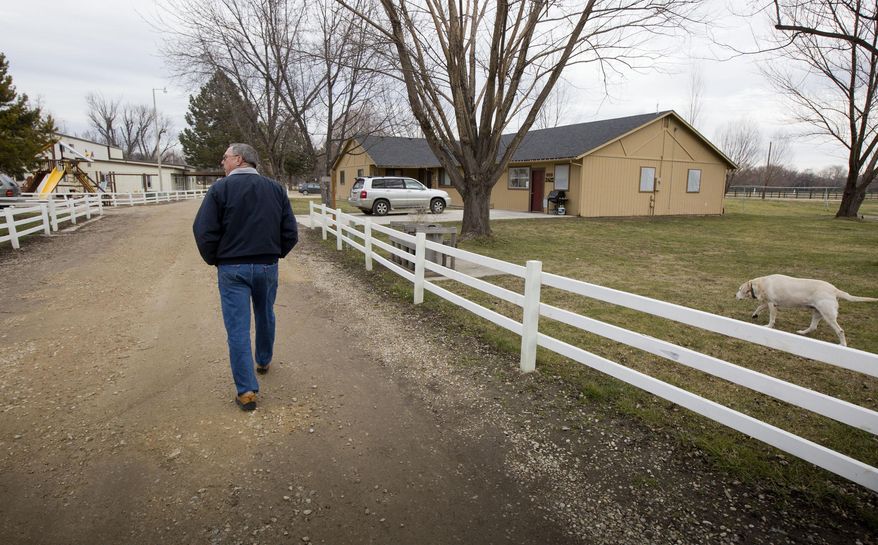 FOR RELEASE SATURDAY, FEBRUARY 6, 2016, AT 12:01 A.M. MST. -Cleve Cushing, executive director of Christian Children's Ranch, walks down a lane Jan. 28, 2016 where homes and a school are provided for children and families in challenging situations. The ranch, located south of Eagle, Idaho on Duck Alley Road, provides a rural lifestyle with horses, chickens and llamas that need tending and everyone pitches in to help. (Darin Oswald/Idaho Statesman via AP)