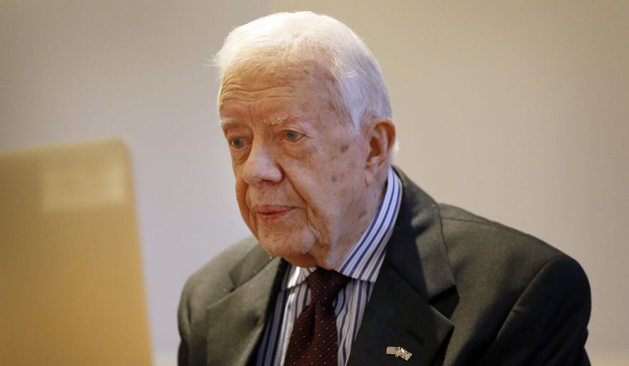 Former U.S. President Jimmy Carter listens during a video interview with The Associated Press via a laptop at a hotel in London, Tuesday, Feb. 2, 2016. (AP Photo/Kirsty Wigglesworth) ** FILE **