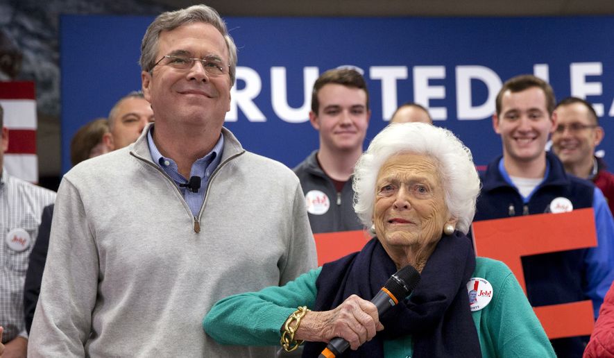 Barbara Bush, right, jokes with her son, Republican presidential candidate, former Florida Gov. Jeb Bush, while introducing him at a town hall meeting at West Running Brook Middle School in Derry, N.H., Thursday Feb. 4, 2016. (AP Photo/Jacquelyn Martin)