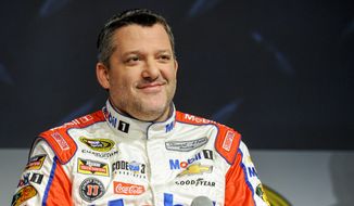 Stewart Haas Racing co-owner and driver Tony Stewart talks to members of the media during the NASCAR Charlotte Motor Speedway Media Tour in Charlotte, N.C., Thursday, Jan. 21, 2016. (AP Photo/Mike McCarn)