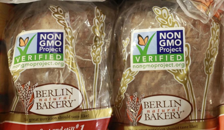 Products labeled with Non Genetically Modified Organism (GMO) are sold at the Lassens Natural Foods &amp; Vitamins store in Los Feliz district of Los Angeles. The food industry is pressuring Congress to act before the state of Vermont requires food labels for genetically modified ingredients. (AP Photo/Damian Dovarganes, File)