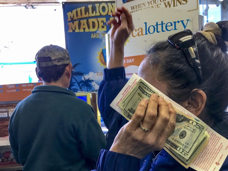 FILE - In this Jan. 13, 2016 file photo, customers wait to buy lottery tickets at the Blue Bird liguor store in Hawthorne, Calif. With hours to go and $63 million on the line, the mystery remains: Where’s the winning California Lottery ticket - the one sold last Aug. 8, that is - and why hasn’t somebody cashed it? Whatever the reason, it won’t be a good enough excuse if the 5 p.m. Thursday, Feb. 4, 2016 deadline passes and nobody produces the ticket at a lottery office. The ticket was sold at a 7-Eleven store in the Chatsworth neighborhood of Los Angeles.(AP Photo/Damian Dovarganes, File)