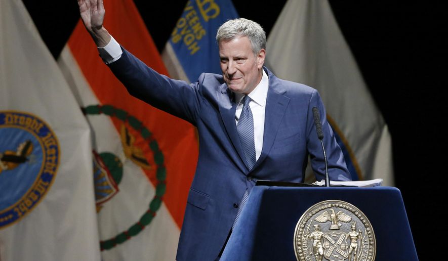 New York Mayor Bill de Blasio waves upon arriving on stage for his State of the City address, Thursday, Feb. 4, 2016, at Lehman College in the Bronx borough of New York. (AP Photo/Kathy Willens)