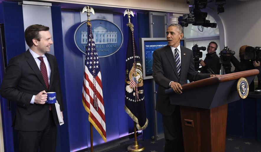 President Barack Obama looks toward White House press secretary Josh Earnest in the Brady Press Briefing Room of the White House in Washington, Friday, Feb. 5, 2016, during a news conference on the economy.  (AP Photo/Susan Walsh)