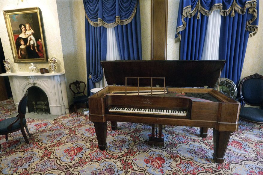 This Feb. 1, 2016 photo shows the recently restored square grand piano Abraham Lincoln likely heard when he courted Mary Todd at Edwards Place in Springfield, Ill. Manufactured in Philadelphia about 1835, the restored 180-year-old instrument will debut Saturday, Feb. 6, 2016 at Edwards Place _ the city’s oldest home that was owned by the husband of Mary Lincoln’s sister and a haunt of the future 16th president. (AP Photo/Seth Perlman)
