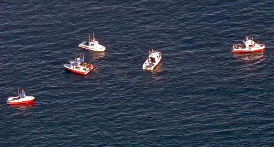 In this still frame from video provided by KABC-TV, a flotilla of boats search for wreckage from two small planes that collided in midair and plunged into the ocean off of Los Angeles harbor Friday, Feb. 5, 2016. There was no immediate word of any survivors, authorities said. The planes collided at around 3:30 p.m. and apparently went into the water about two miles outside the harbor entrance, U.S. Coast Guard and other officials said.(KABC-TV via AP) MANDATORY CREDIT TV OUT