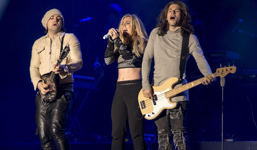 Neil, Kimberly and Reid Perry of The Band Perry perform at The City Stage in Super Bowl City in San Francisco, Thursday, Feb. 4, 2016. On July 3, 2016, their Selbyville, Delaware concert was postponed due to "terroristic" threats from two individuals. (Photo by Peter Barreras/Invision/AP) **FILE*