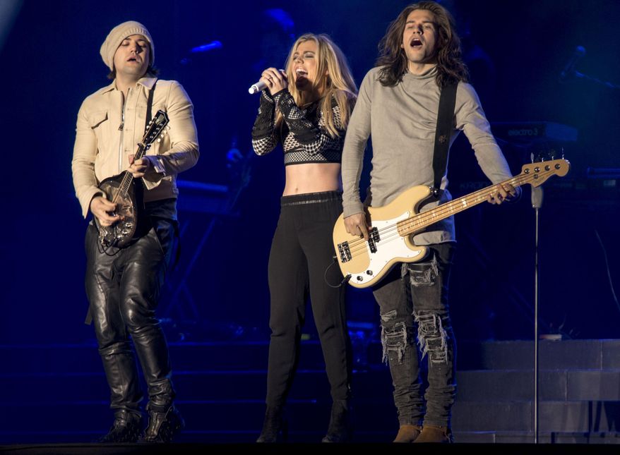Neil, Kimberly and Reid Perry of The Band Perry perform at The City Stage in Super Bowl City in San Francisco, Thursday, Feb. 4, 2016. On July 3, 2016, their Selbyville, Delaware concert was postponed due to "terroristic" threats from two individuals. (Photo by Peter Barreras/Invision/AP) **FILE*