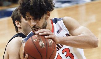 Virginia&#39;s Anthony Gill (13) goes to the hoop as Pittsburgh&#39;s Rafael Maia defends during the second half of an NCAA college basketball game, Saturday, Feb. 6, 2016, in Pittsburgh. Virginia won 64-50. (AP Photo/Keith Srakocic)