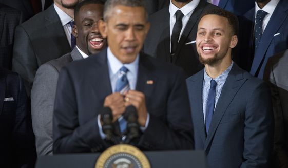 Golden State Warriors players, Draymond Green, left, and Stephen Curry, right, reacts to watching President Barack Obama, center, mimicking Curry&#39;s &#39;clowning&#39; on the basketball court, during a ceremony honoring the 2015 NBA Champions during a ceremony in the East Room of the White House in Washington, Thursday, Feb. 4, 2016. (AP Photo/Pablo Martinez Monsivais)