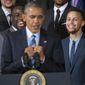 Golden State Warriors players, Draymond Green, left, and Stephen Curry, right, reacts to watching President Barack Obama, center, mimicking Curry&#39;s &#39;clowning&#39; on the basketball court, during a ceremony honoring the 2015 NBA Champions during a ceremony in the East Room of the White House in Washington, Thursday, Feb. 4, 2016. (AP Photo/Pablo Martinez Monsivais)