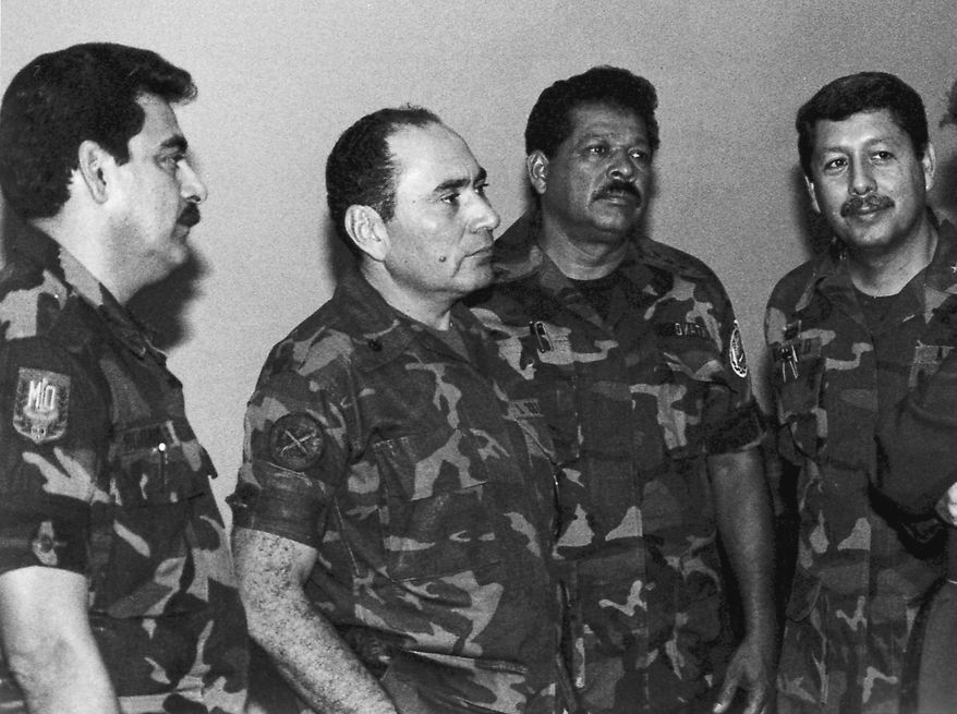 FILE - This July 1989 file photo shows, from left, Col. Rene Emilio Ponce, then head of the Salvadoran Armed Forces joint chiefs of staff, Rafael Humberto Larios, then El Salvador's defense minister, Col. Inocente Orlando Montano, then public safety vice minister and Col. Juan Orlando Zepeda, then defense vice minister, in an undisclosed location in El Salvador. Salvadoran military implicated in the murder of six Jesuit priests in 1989 said they are innocent and that the real culprits have already been tried, convicted and amnestied. On Tuesday, Feb. 2, 2016, seven former soldiers put out a statement saying they are victims of political persecution and that they filed with the Supreme Court a writ of habeas corpus to avoid being captured and extradited to Spain. Ponce, left, died in El Salvador on May 2, 2011. (La Prensa Grafica via AP, File) EL SALVADOR OUT - NO PUBLICAR EN EL SALVADOR