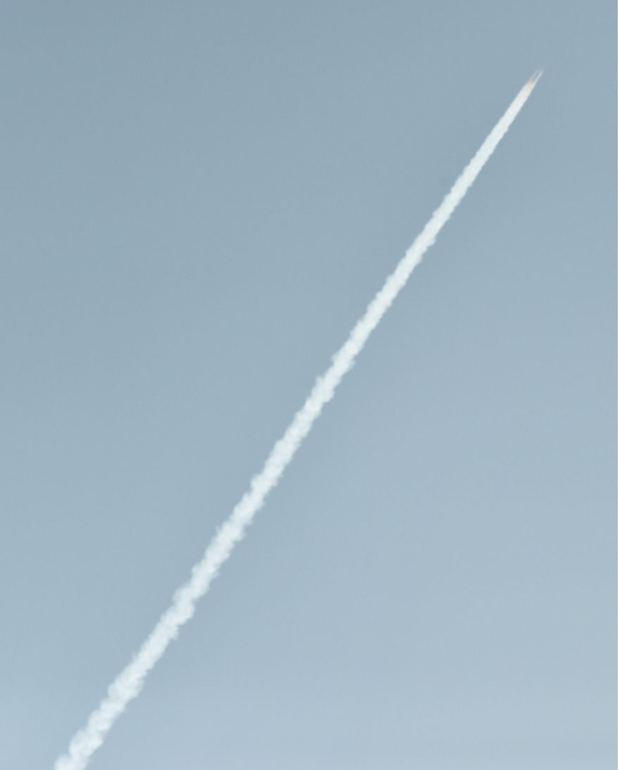 In this image released by Japan's Kyodo News agency, an unidentified object is photographed in the sky from Dandong, China, near the North Korean border, Sunday, Feb. 7, 2016, at the same time a North Korea rocket was allegedly launched. North Korea on Sunday defied international warnings and launched a long-range rocket that the United Nations and others call a cover for a banned test of technology for a missile that could strike the U.S. mainland. (Minoru Iwasaki/Kyodo News via AP) JAPAN OUT, MANDATORY CREDIT
