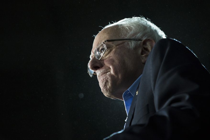 Democratic presidential candidate Sen. Bernie Sanders, I-Vt., grimaces as he delivers his stump speech during a campaign stop at the University of New Hampshire Whittemore Center Arena, Monday, Feb. 8, 2016, in Durham, N.H. (AP Photo/John Minchillo) ** FILE **