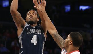Georgetown guard D&#39;Vauntes Smith-Rivera (4) scored 24 points in the Hoyas&#39; 92-67 win over St. John&#39;s on Monday night. (Associated Press) **FILE**