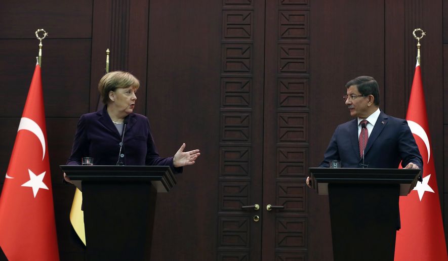 German Chancellor Angela Merkel, left, speaks to the media during a joint news conference with Turkish Prime Minister Ahmet Davutoglu in Ankara, Turkey, Monday, Feb. 8, 2016. Turkey and Germany agreed on Monday on a set of measures to deal with the Syrian refugee crisis, including a joint diplomatic initiative aiming to halt attacks against Syria&#39;s largest city. Merkel said after talks with Davutoglu that she is &quot;not just appalled but horrified&quot; by the suffering caused by Russian bombing in Syria. (AP Photo/Burhan Ozbilici)