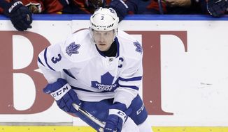 Toronto Maple Leafs defenseman Dion Phaneuf (3) skates with the puck against the Florida Panthers during the second period of an NHL hockey game, Tuesday, Jan. 26, 2016, in Sunrise, Fla. (AP Photo/Alan Diaz)