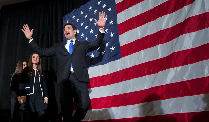 Republican presidential candidate Sen. Marco Rubio, R-Fla., gestures to the crowd as he arrives, followed by his daughters Amanda Rubio, 15, and Daniella Rubio, 13, at his primary night rally at the Radisson Hotel in Manchester, N.H., on Tuesday Feb. 9, 2016. (AP Photo/Jacquelyn Martin)