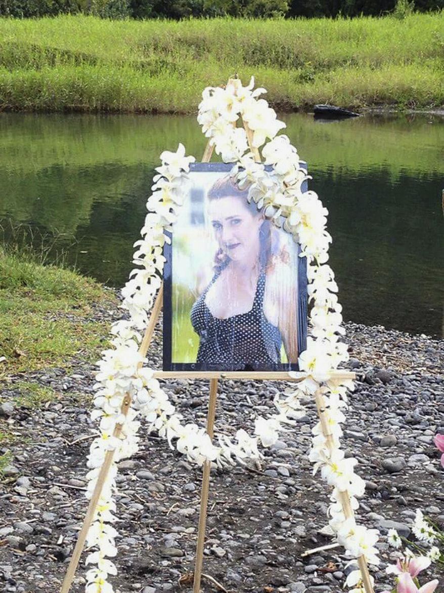 This February 2015 photo provided by Kimberlyn Scott shows a photo of Scott’s daughter, Carly “Charli” Scott, displayed at a memorial service in Keanae, Hawaii. Carly “Charli” Scott was five months pregnant when she disappeared on Maui in February 2014 and Charli Scott’s ex-boyfriend, Steven Capobianco, is accused of killing Scott. His trial is set for this spring. Lawmakers are considering a measure that would establish constitutional rights for crime victims. Victims and family members crowded into a hearing room Tuesday, Feb. 9, 2016, to speak in support of the bill, also known as Marsy's Law, which would require the state to inform victims and their immediate family of court proceedings and key developments in cases. (Kimberlyn Scott via AP)