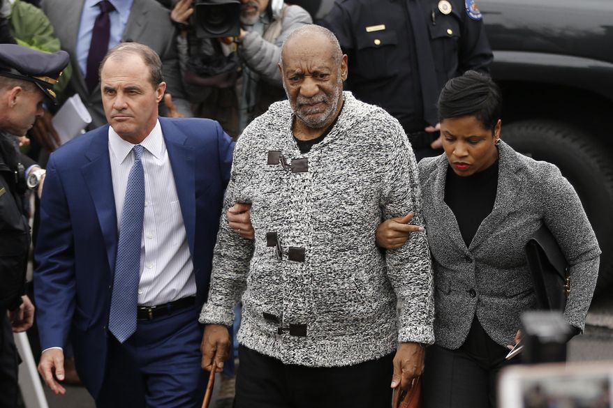 FILE - In this Dec. 30, 2015 file photo Bill Cosby, center, accompanied by his attorneys Brian McMonagle, left, and Monique Pressley, arrives at court to face a felony charge of aggravated indecent assault, in Elkins Park, Pa. A Los Angeles judge on Tuesday, Feb. 9, 2016, dismissed Cosby's former attorney Martin Singer from a defamation lawsuit filed by model Janice Dickinson over denials of her allegations the comedian drugged and raped her in Lake Tahoe, Calif., in 1982. (AP Photo/Matt Rourke, File)