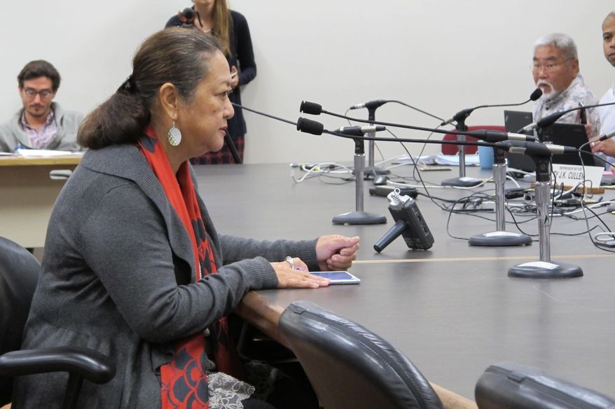 Lorna Cummings Poe, a Kauai resident, speaks to Hawaii lawmakers that she believes her granddaughters were sickened after exposure to pesticides at a legislative hearing on Tuesday, Feb. 9, 2016 in Honolulu. Parents are pushing Hawaii lawmakers to establish pesticide buffer zones around schools. (AP Photo/Cathy Bussewitz)