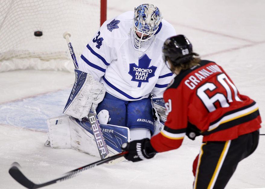 Calgary Flames&#39; Markus Granlund (60) from Finland scores a short handed goal on Toronto Maple Leafs goalie James Reimer during first period NHL action in Calgary, Alberta, Tuesday, Feb. 9, 2016. (Larry MacDougal/The Canadian Press via AP) MANDATORY CREDIT
