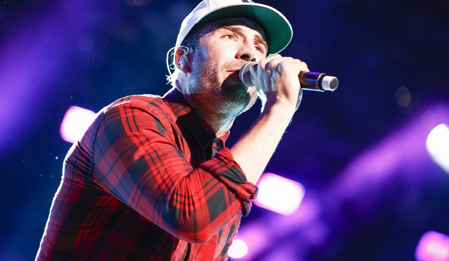 FILE - In this June 11, 2015 file photo, Sam Hunt performs at LP Field at the CMA Music Festival n Nashville, Tenn. Hunt is nominated for two Grammys for best country album and best new artist. The Grammys will air live, Monday, Feb. 15, on CBS at 8 p.m. ET. (Photo by Al Wagner/Invision/AP, File)
