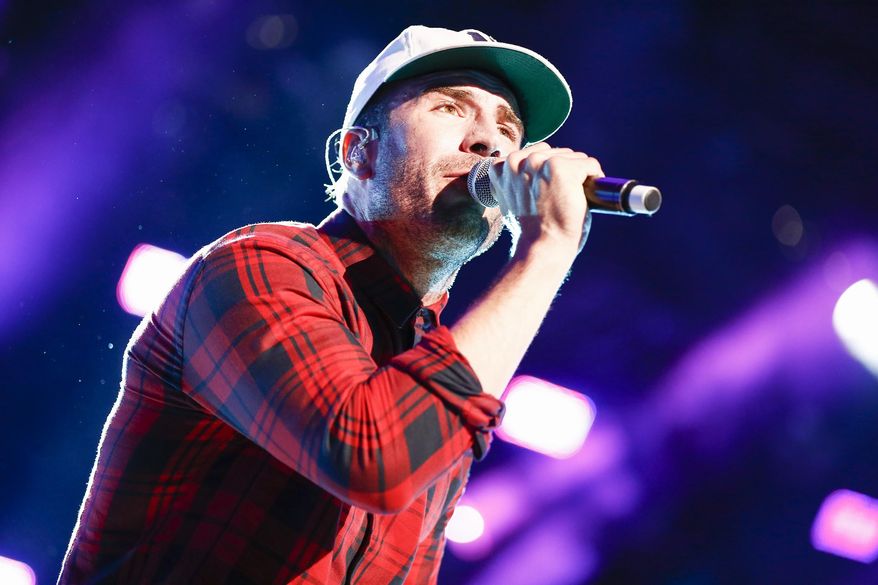 FILE - In this June 11, 2015 file photo, Sam Hunt performs at LP Field at the CMA Music Festival n Nashville, Tenn. Hunt is nominated for two Grammys for best country album and best new artist. The Grammys will air live, Monday, Feb. 15, on CBS at 8 p.m. ET. (Photo by Al Wagner/Invision/AP, File)