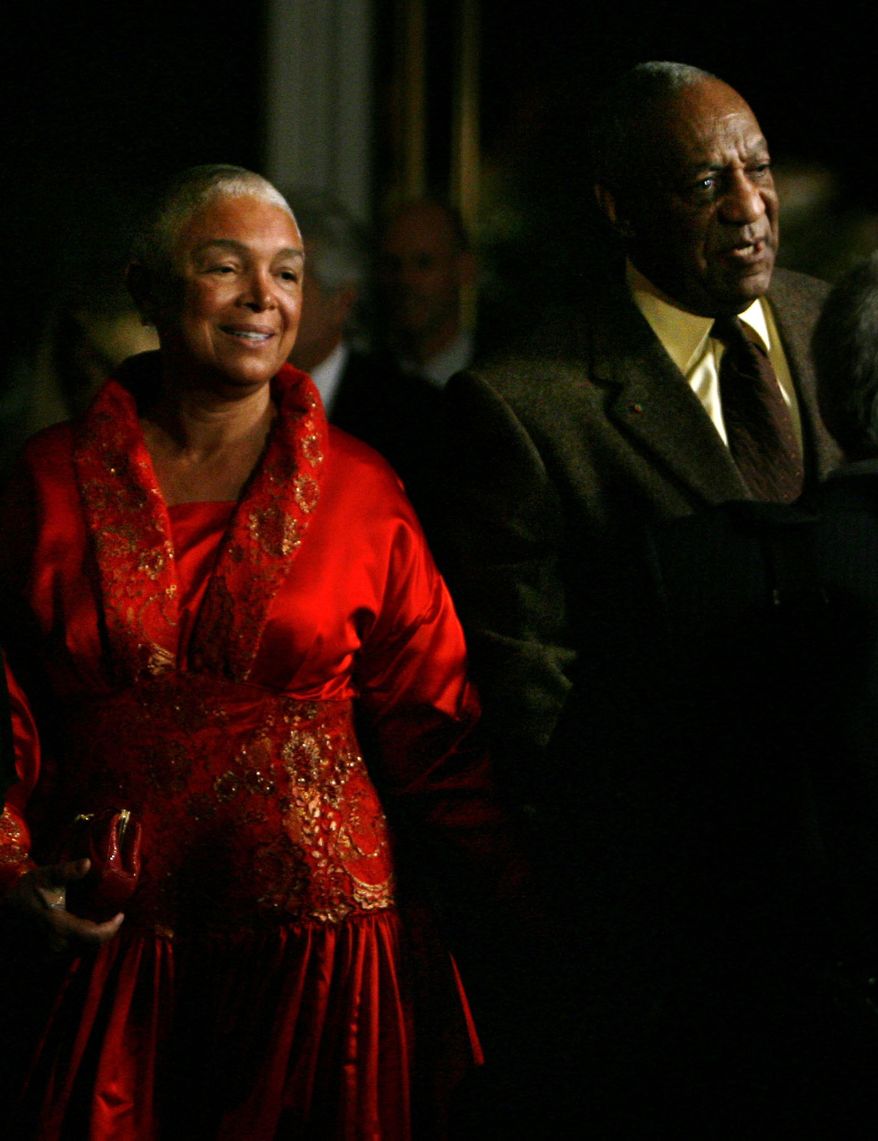 File- This Oct.26, 2009, file photo shows comedian Bill Cosby entering the Kennedy Center with his wife Camille in Washington. A federal judge in Massachusetts has ruled that Cosby's wife must answer questions under oath in a defamation lawsuit filed by seven women who claim Cosby sexually assaulted them decades ago. A lawyer for the women has sought to compel Camille Cosby to give a deposition in the lawsuit. Last month, a magistrate judge rejected Cosby's bid to quash the deposition subpoena. (AP Photo/Jacquelyn Martin, File)