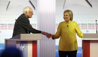 Democratic presidential candidates, Sen. Bernie Sanders, I-Vt, and Hillary Clinton shake hands after a Democratic presidential primary debate at the University of Wisconsin-Milwaukee, Thursday, Feb. 11, 2016, in Milwaukee. (AP Photo/Morry Gash) ** FILE **