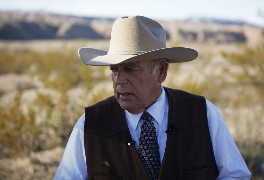 Rancher Cliven Bundy stands along the road near his ranch in this Jan. 27, 2016, file photo in Bunkerville, Nev. (AP Photo/John Locher)