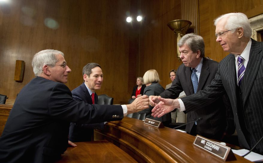 NIH National Institute of Allergy and Infectious Diseases Director Anthony Fauci, left, and CDC Director Thomas Frieden, second from left, shake hands with Senate Labor, Health and Human Services, Education, and Related Agencies subcommittee Chairman Roy Blunt, R-Mo., and subcommittee member Sen. Thad Cochran, R-Miss., right, at the conclusion of the subcommittee's hearing “to review emerging health threats and the Zika supplemental request,” Thursday, Feb. 11, 2016, on Capitol Hill in Washington. (AP Photo/Manuel Balce Ceneta)